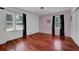 Cozy bedroom with hardwood flooring, natural light, and closet at 5185 Twin Oak Ne Dr, Woodstock, GA 30188