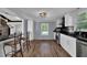 Spacious kitchen with stainless steel appliances, and breakfast bar at 5185 Twin Oak Ne Dr, Woodstock, GA 30188