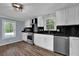 View of updated kitchen leading to the outdoor pool at 5185 Twin Oak Ne Dr, Woodstock, GA 30188