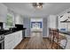 Updated kitchen with a snack bar and white cabinetry at 5185 Twin Oak Ne Dr, Woodstock, GA 30188