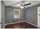 Bedroom featuring hardwood floors, ceiling fan, and one window at 2412 Forrest Park Se Rd, Atlanta, GA 30315