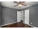 Bedroom featuring hardwood floors, ceiling fan, and two doors at 2412 Forrest Park Se Rd, Atlanta, GA 30315