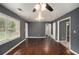 Spacious living room with hardwood floors, abundant natural light, and neutral gray walls at 2412 Forrest Park Se Rd, Atlanta, GA 30315