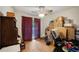 Bedroom with wood floors, desk, and sliding glass doors covered with red curtains at 2502 Kerry Ne Ct, Marietta, GA 30066
