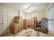 Bedroom filled with moving boxes, a ceiling fan, and natural light from the window at 2502 Kerry Ne Ct, Marietta, GA 30066