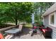 Spacious deck with comfortable seating, an umbrella, and views of the backyard and trees at 2502 Kerry Ne Ct, Marietta, GA 30066
