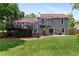 Back exterior with large deck, a second story balcony, a patio and mature landscaping at 2502 Kerry Ne Ct, Marietta, GA 30066