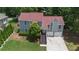 Charming two-story home with a well-manicured lawn and a two-car garage offers great curb appeal at 2502 Kerry Ne Ct, Marietta, GA 30066