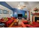 Spacious living room features a fireplace, hardwood floors, and a ceiling fan, perfect for relaxation at 2502 Kerry Ne Ct, Marietta, GA 30066