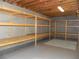 Unfinished basement with wooden shelving units along the back wall at 4019 Hickory Fairway Dr, Woodstock, GA 30188