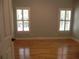 Bedroom with hardwood floors and lots of natural light from windows at 4019 Hickory Fairway Dr, Woodstock, GA 30188