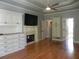 Elegant bedroom features hardwood floors, fireplace, built-in cabinets, creating a serene retreat at 4019 Hickory Fairway Dr, Woodstock, GA 30188