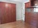 Spacious walk-in closet featuring custom wood cabinetry, drawers, and ample storage space with hardwood floor at 4019 Hickory Fairway Dr, Woodstock, GA 30188