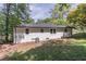 Home featuring a spacious backyard, mature trees, and great outdoor space at 810 Parkway Se Dr, Smyrna, GA 30080