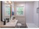 Updated bathroom featuring modern fixtures, white subway tile, and vanity at 810 Parkway Se Dr, Smyrna, GA 30080