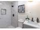 A modern bathroom with updated vanity, fixtures, toilet, and a tiled shower at 810 Parkway Se Dr, Smyrna, GA 30080