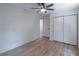 Neutral bedroom with hardwood floors, a ceiling fan, and spacious closet at 810 Parkway Se Dr, Smyrna, GA 30080
