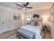 Cozy bedroom featuring lots of natural light, a ceiling fan, and neutral decor at 810 Parkway Se Dr, Smyrna, GA 30080