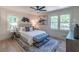 Cozy bedroom featuring lots of natural light, a ceiling fan, and neutral decor at 810 Parkway Se Dr, Smyrna, GA 30080