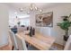 Contemporary dining area with a view to the living room featuring modern furniture and decor at 810 Parkway Se Dr, Smyrna, GA 30080