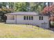 Beautifully maintained brick home with garage, featuring a healthy lawn and mature, vibrant trees at 810 Parkway Se Dr, Smyrna, GA 30080