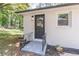Charming home featuring a private entrance, updated light fixture, and mature landscaping at 810 Parkway Se Dr, Smyrna, GA 30080