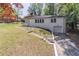 Lovely brick home featuring a garage and a well-maintained lawn, complemented by mature trees at 810 Parkway Se Dr, Smyrna, GA 30080