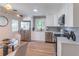 Bright kitchen featuring stainless steel appliances, white cabinetry, and quartz countertops at 810 Parkway Se Dr, Smyrna, GA 30080