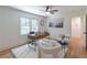 Bright home office with hardwood floors, ceiling fan, stylish decor, and natural light at 810 Parkway Se Dr, Smyrna, GA 30080