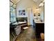 Luxurious bathroom featuring a standalone tub, elegant vanity, and glass-enclosed shower at 216 Slate Dr, Buford, GA 30518