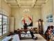 Elegant home office with coffered ceiling, a stylish chandelier and a large abstract painting at 216 Slate Dr, Buford, GA 30518