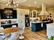Spacious kitchen with contrasting cabinetry, large island, and modern appliances at 216 Slate Dr, Buford, GA 30518