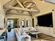 Bright living room with vaulted ceilings, wood beams, and modern furnishings at 216 Slate Dr, Buford, GA 30518