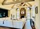 Inviting living room with stone fireplace, wood beams, and French doors to the yard at 216 Slate Dr, Buford, GA 30518