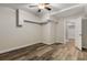 Spacious basement room featuring vinyl floors and a ceiling fan, perfect for a home office or additional living space at 1200 Taylor Oaks Dr, Roswell, GA 30076