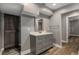 Bathroom featuring wood flooring, a vanity with drawers, mirror and a barn door for privacy at 1200 Taylor Oaks Dr, Roswell, GA 30076