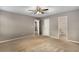 Spacious bedroom featuring neutral paint, ceiling fan, and carpeted flooring at 1200 Taylor Oaks Dr, Roswell, GA 30076