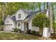 Charming home featuring a two-car garage, chimney and mature trees at 1200 Taylor Oaks Dr, Roswell, GA 30076