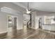 Open-concept living space featuring dark floors, staircase, and bright natural lighting at 1200 Taylor Oaks Dr, Roswell, GA 30076