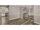 Open-concept living space featuring dark floors and bright natural lighting at 1200 Taylor Oaks Dr, Roswell, GA 30076