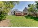 Spacious backyard featuring a well-maintained lawn and a charming wooden deck, perfect for outdoor entertaining at 2982 Ringle Rd, Brookhaven, GA 30341