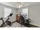 Comfortable bedroom features a home office, a neutral color palette, and ceiling fan for functional and inviting atmosphere at 2982 Ringle Rd, Brookhaven, GA 30341
