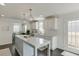 Well-lit kitchen with white cabinets, marble countertops, and a central island at 2982 Ringle Rd, Brookhaven, GA 30341
