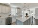 Beautiful kitchen with marble countertops, stainless steel appliances and pendant lighting at 2982 Ringle Rd, Brookhaven, GA 30341