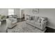 Inviting living room features hardwood floors and stylish neutral furniture at 2982 Ringle Rd, Brookhaven, GA 30341