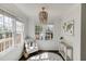 Bright sitting area features natural light, a stylish beaded chandelier, and neutral decor for a cozy and inviting ambiance at 2982 Ringle Rd, Brookhaven, GA 30341