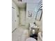 Modern bathroom with marble floors, framed vanity mirror and updated fixtures at 4437 Janice Dr, Snellville, GA 30039