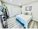 This bedroom features neutral walls, light wood-look flooring, and a spacious closet at 4437 Janice Dr, Snellville, GA 30039