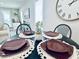 Charming dining area features a round table set for four with stylish place settings at 4437 Janice Dr, Snellville, GA 30039