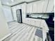 Spacious kitchen with stainless steel appliances, white cabinets, and ample counter space at 4437 Janice Dr, Snellville, GA 30039